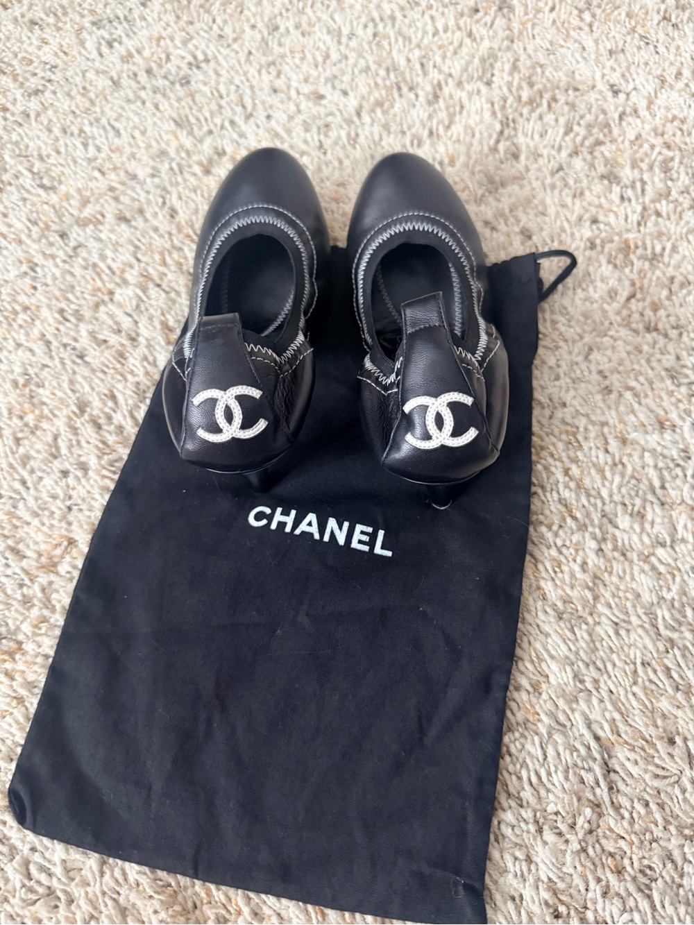 CHANEL Black Leather Ballet Flats with Silver CC Emblem